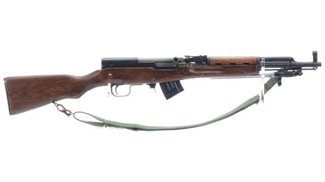 The SKS rifle is effective at a firing range of 440 yards. Its muzzle velocity 734 m/s (2,411 ft/s) is extremely powerful for its time of conception. The chrome-plated barrel extends to 20 inches on the 520 mm and 22 inches on the M59/66. Furthermore, the SKS carbine features a front and rear sight.. Sks bnat12